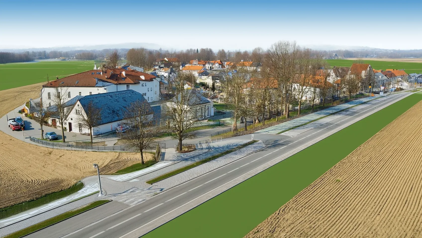 Luftbild einer Ortsrandlage im Winter mit neuer Stra&szlig;e und angrenzendem Acker als Grundlage f&uuml;r Starkregen-Gel&auml;ndedaten